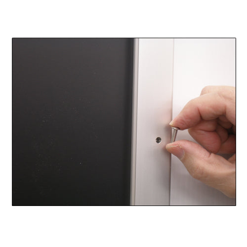 REMOVE SECURITY SCREWS FROM THE FRAME PROFILE TO REPLACE POSTERS 16 x 20
